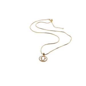 Detailed close-up of a 14k gold plated Hamsa Hand pendant on a classic box chain