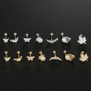 Detailed macro view of butterfly and bee shaped ear studs with micro-pave cubic zirconia