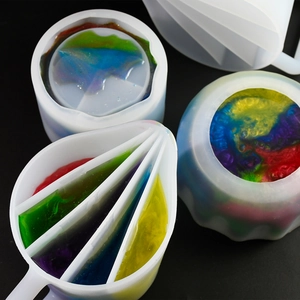Macro detail of 4-slot silicone split cup with colorful resin for DIY fluid art and craft