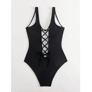 Slimming black one-piece swimsuit with deep V-neck and front lace-up tie detail