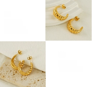 Detailed macro view of 18K gold plated hoop earrings with vintage spiral texture