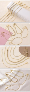 Macro shot of 5-piece gold-plated bracelet set featuring snake and cuban link chains