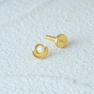 Detail view of the S925 sterling silver crescent moon stud with white opal and hallmark