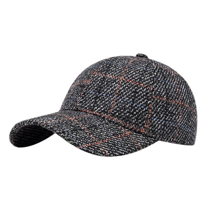 British style plaid tweed baseball cap in black and white with subtle orange blue accents