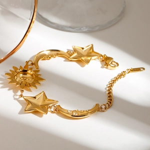 18K gold plated stainless steel bracelet featuring sun moon and stars celestial charms
