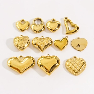 Golden stainless steel heart pendants set with varied textures on white background
