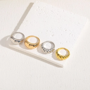 Minimalist 14K gold and silver plated smooth and twisted metal rings set on stone