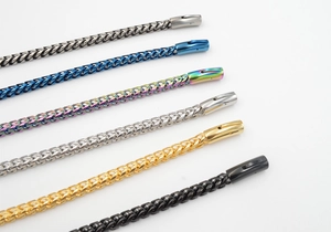 Detailed view of woven wheat chains in multiple colors including black, gold, and blue