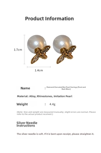 Macro shot of bee stud earrings featuring sparkling crystals and large faux pearls