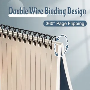 Thick A5 spiral notebook with black double coil binding and ruled pages for writing