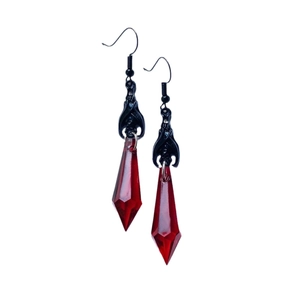 Gothic black bat earrings with red teardrop crystal pendants on white background