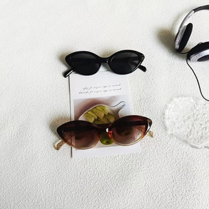 Fashionable cat eye sunglasses in black and tortoiseshell colors for UV protection