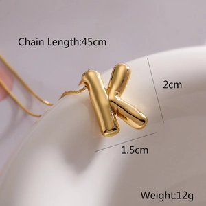 Detail view of gold letter K balloon pendant with 45cm chain length and weight 12g