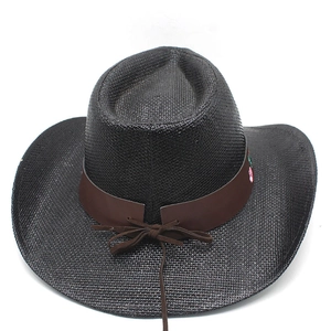 Detail of black woven cowboy hat featuring brown leather band and floral embroidery