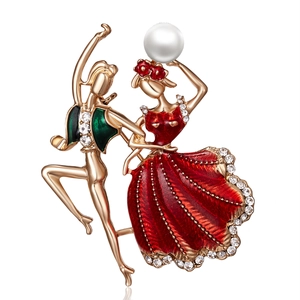 Detailed macro of dancers brooch with red enamel, crystal dress and white pearl