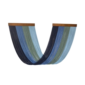 Bohemian style wall hanging featuring gradient blue cotton tassels and wooden rods