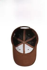 Detail view of brown baseball cap interior with reinforced seams and breathable eyelets