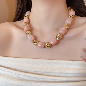 Detail of pink marble beads and irregular gold accents on this irregular beaded bracelet
