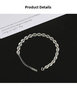 Detailed macro view of S925 sterling silver pig nose link bracelet with lobster clasp