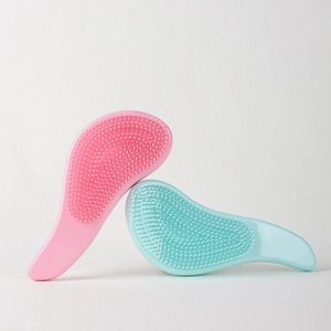 Pink and mint green detangling hair brushes with soft bristles for wet and dry hair