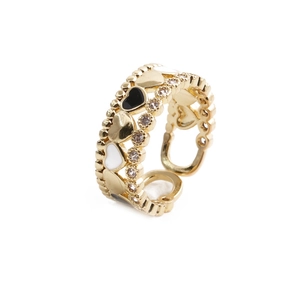 Detailed close-up of golden heart ring with micro-pave crystals and enamel hearts