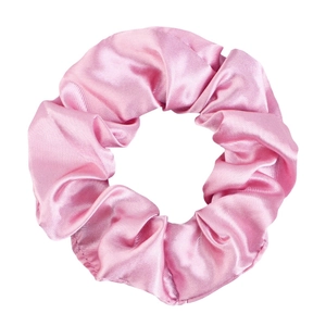 Detailed view of pink satin scrunchie showing smooth texture and elastic pleats