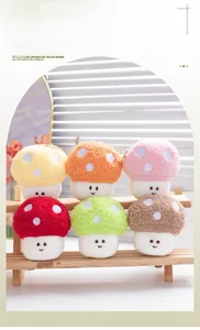 Colorful plush mushroom pendants in soft sherpa fabric with gold chains on a wooden shelf