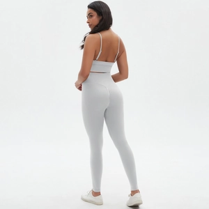 Rear view of grey yoga set featuring a backless sports bra and high-waisted leggings