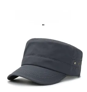 Detail of grey quick-dry flat top cap with metal eyelets and reinforced stitching