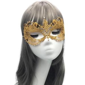 Elegant gold lace masquerade mask with rhinestones on model for Halloween parties