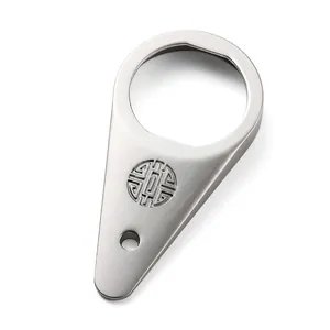 Close-up of teardrop stainless steel bottle opener with engraved traditional pattern