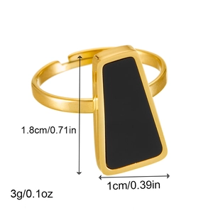 Detailed view of golden open ring with black trapezoid stone and precise measurements