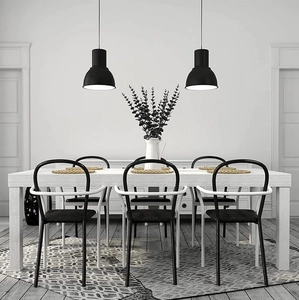 Modern black and white dining set featuring a white wooden table and six designer chairs