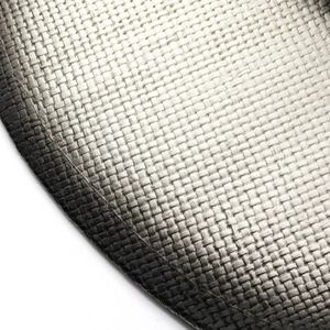 Detailed close-up of woven straw texture with black and cream color gradient on hat brim