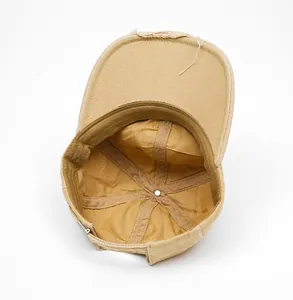 Internal view of khaki cotton baseball cap showing lining, sweatband and metal buckle