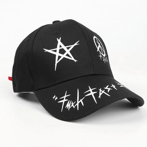 Detail of black cotton baseball cap featuring white graffiti patterns and a star print