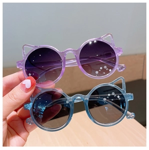 Detail of cute cat ear sunglasses in translucent purple and blue for kids