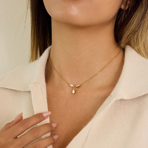 18K gold plated stainless steel necklace with white zircon teardrop pendant on model