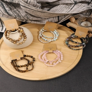 Handmade natural stone beaded bracelets in multi-color sets with bamboo tray display
