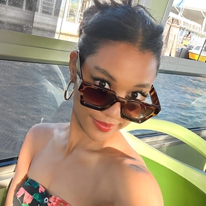 Retro tortoise shell rectangle sunglasses with brown lenses shown on a model