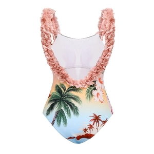 Detail view of tropical coconut tree print swimsuit with 3D floral shoulder straps and open back