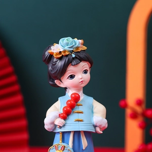 Detailed close-up of a Hanfu girl figurine with blue floral headwear and a tanghulu stick