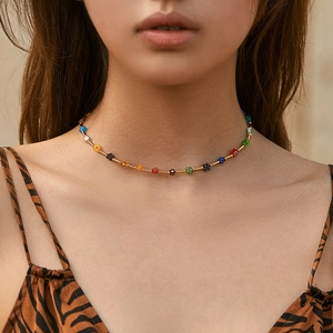 Handmade bohemian choker with colorful beaded flowers and golden metal spacers