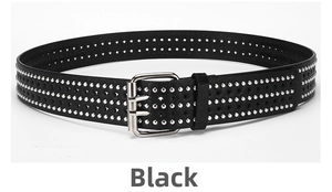 Detail of black punk leather belt with triple-row silver rivets and star cutouts