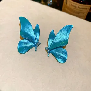 Peacock blue butterfly drop earrings with silver pins and crystal accents for women