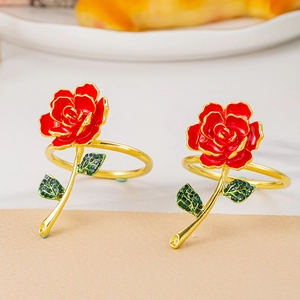Elegant red rose napkin ring with gold stem and green crystal leaves for table decor