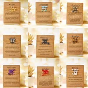 Set of 9 woven healing crystal chip bracelets featuring amethyst and white turquoise