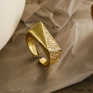 Detailed view of gold plated open ring with geometric crystal triangles and size dimensions