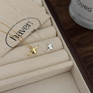 Minimalist 925 sterling silver heart necklaces in gold and silver finish in a jewelry box