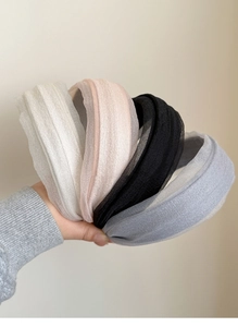 Close-up of padded headbands featuring delicate pleated tulle and soft sponge structure
